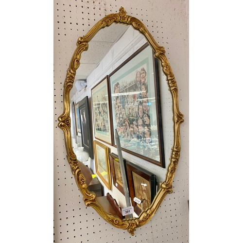 391 - Ornate gilt framed wall mirror 72cm s 42cm