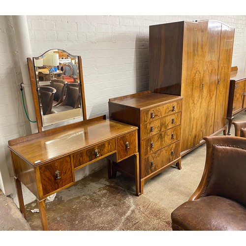 558 - Bedroom suite comprising mirror back dressing table, four-drawer chest & three-piece wardrobe