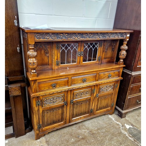 650 - Carved oak glazed sideboard, H 137cm, W 137cm, D 46cm