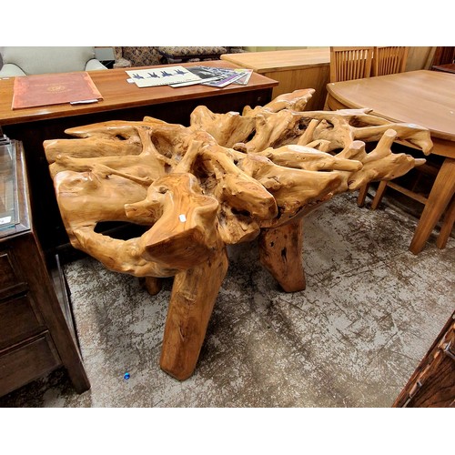 571 - Highly carved hardwood table, (glass top missing)H approx. 80cm, W approx. 140cm