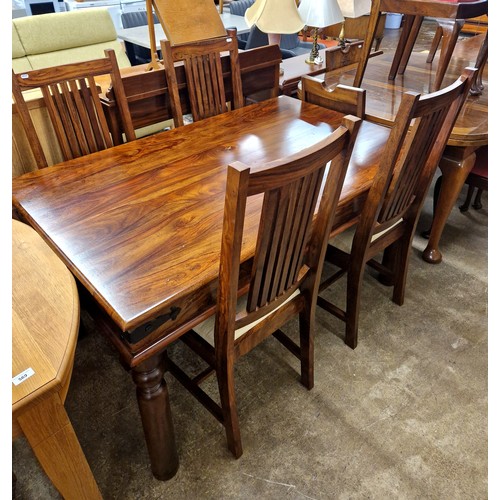 566 - Hardwood dining table with four matching chairs