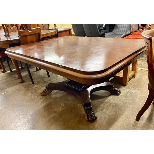 560 - William IV mahogany tip up rectangular center table, raised on central column on quadraform base rai... 