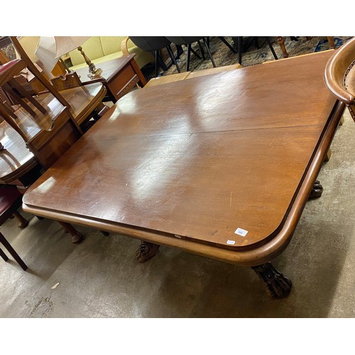 560 - William IV mahogany tip up rectangular center table, raised on central column on quadraform base rai... 