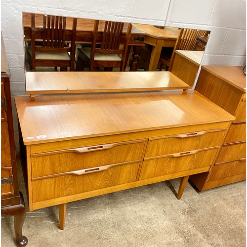 565 - Mid-century J.S. Sakol teak bedroom suite comprising mirror back sideboard, four-drawer chest and mi... 