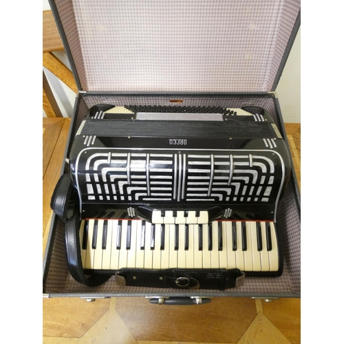 162 - An Italian Orfeo 120 accordion, in black finish and fitted leather case.