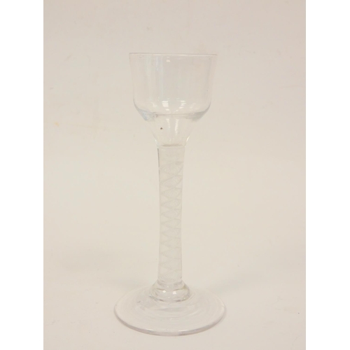 166 - Antique lead crystal cordial glass with helical air twist stem. Height 15cm.