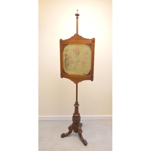 388 - 19th century mahogany fire screen with framed velvet floral panel, raised on scrolled tripod support... 