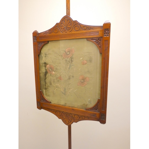 388 - 19th century mahogany fire screen with framed velvet floral panel, raised on scrolled tripod support... 