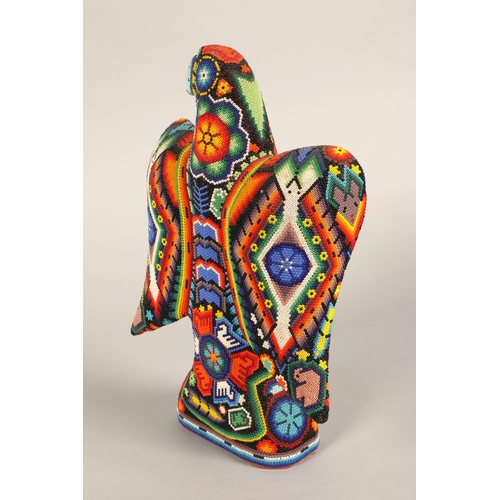 26 - A Mexican Huichol beaded eagle figure, 32cm h