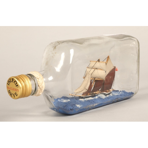 33 - Ship in a bottle, 'Topsail Schooner Sweetheart Abbey built 1875' written on base