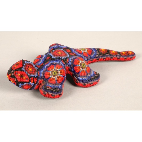 48 - Two Mexican beaded Huichol figures, lizard and winged horse