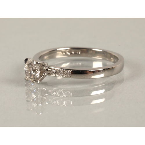 50 - Platinum brilliant cut 0.50ct diamond solitaire ring with diamond shoulders, ring size N/O