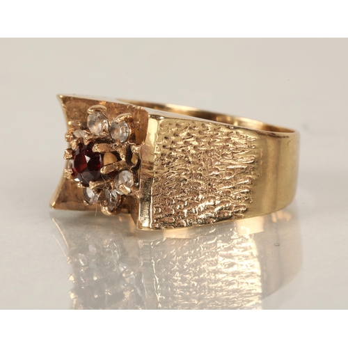 95 - 9ct gold ring set with white gems (one missing) surrounding a pink gem, ring size O, 5.9g