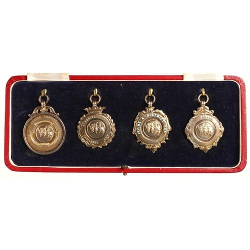 118 - Four hallmarked silver football medals awarded to J. McIntosh, Kilbirnie Ladeside FC, 1949-50 includ... 