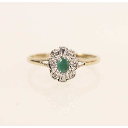 412 - 9ct gold ring set with central oval emerald and a halo of illusion set diamonds, size R/S, 2.0g.