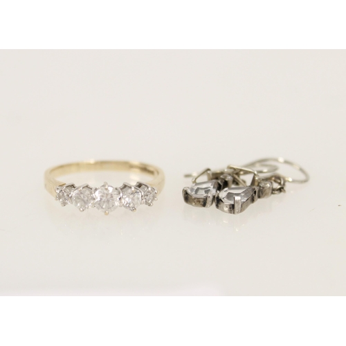 423 - 14ct gold ring set with five white stones, 2.8g, together with a pair of silver and white stone earr... 