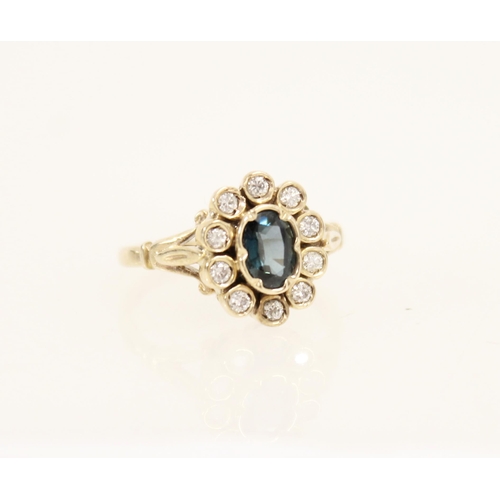 434 - 9ct gold blue stone and diamond cluster ring, size L, 2.7g.