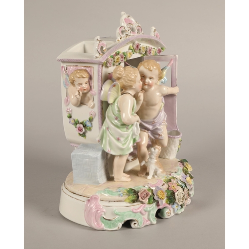 224 - Continental figure possibly German, cherubs in a carriage, 22cm h