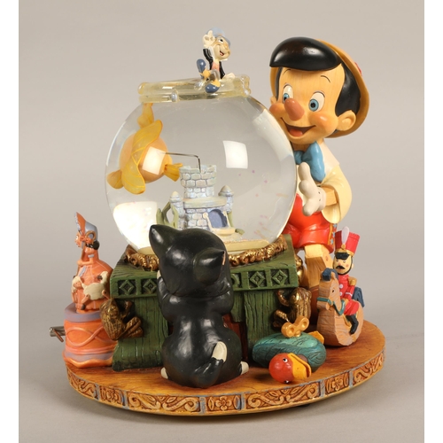 243 - Pinnochio Disney musical snowglobe