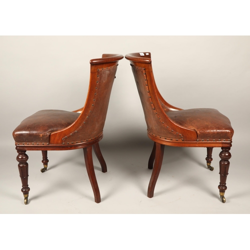 561 - Six Victorian leather upholstered mahogany dining chairs raised on casters