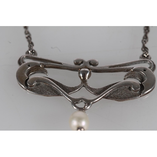 441 - Ola Marie Gorie silver stylized bird and suspended pearl pendant on silver chain.