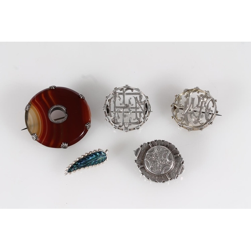 445 - Three Victorian silver brooches, Victorian agate and white metal cloak brooch and a later silver and... 