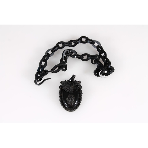 448 - Victorian Whitby Jet locket pendant in the form of an acorn with applied rose on a Whitby Jet chain ... 