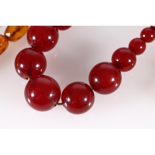 449 - Cherry amber bakelite or Lucite beaded necklace, 34g, together with two other faceted bead necklaces... 