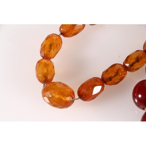 449 - Cherry amber bakelite or Lucite beaded necklace, 34g, together with two other faceted bead necklaces... 