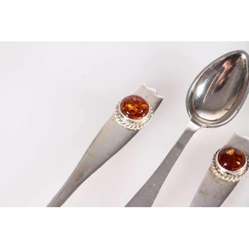 488A - Set of six hallmarked silver teaspoons with cabochon amber terminals, 70g.