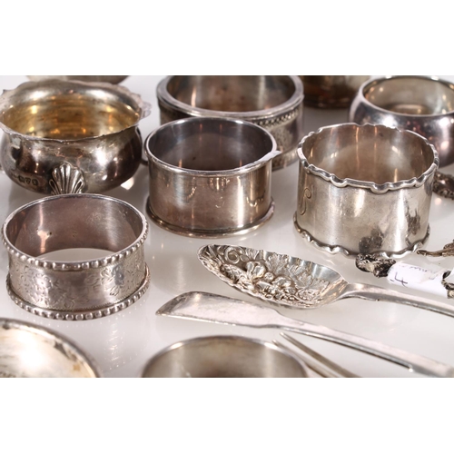 489A - Selection of hallmarked silver incl. spoons, napkin rings, salt pots etc. gross 576g.