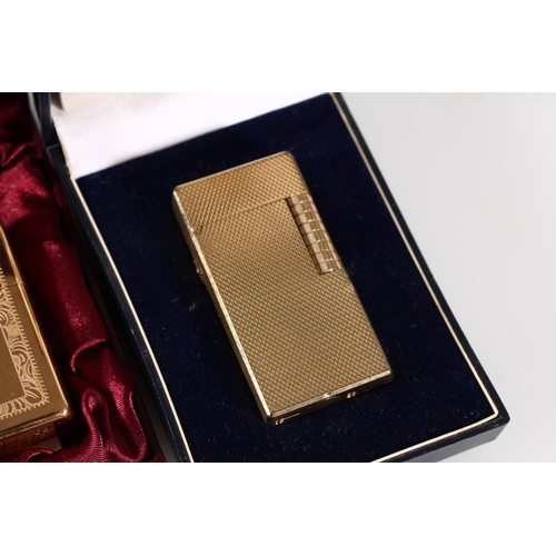 492 - Dunhill gold plated lighter in original case together with a Zippo for H. Samuel lighter in original... 