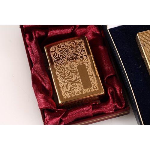 492 - Dunhill gold plated lighter in original case together with a Zippo for H. Samuel lighter in original... 