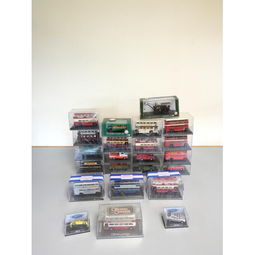 135 - A group of 1:76 scale models behind plexiglass cases comprising of issues by Oxford, Corgi etc. To i... 