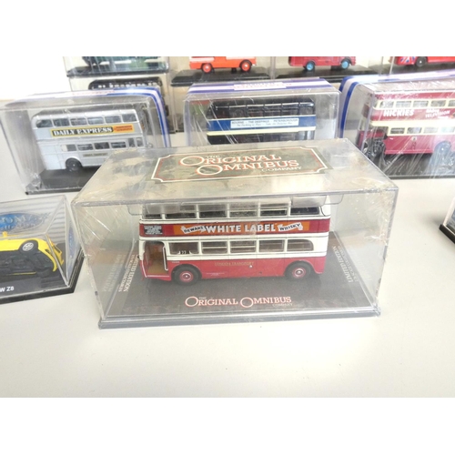 135 - A group of 1:76 scale models behind plexiglass cases comprising of issues by Oxford, Corgi etc. To i... 