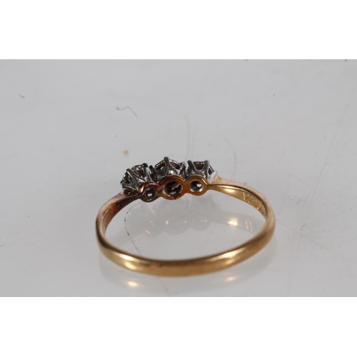 504 - 18ct gold and platinum diamond three stone ring, approximately 0.1ct gross, size M, 1.5g.