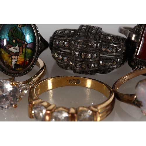 510 - Dress rings to include a rolled gold ring set with large raw opal, Art Deco style marcasite set cock... 