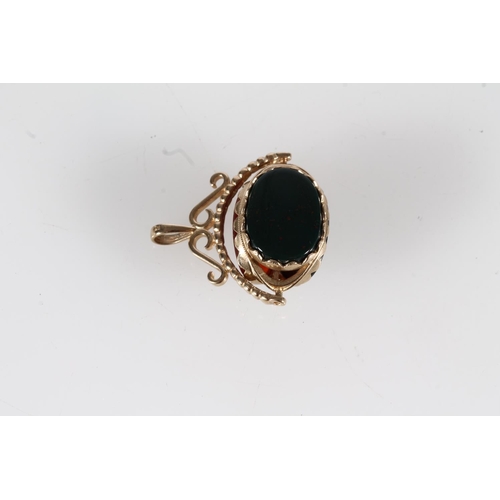 522 - 9ct gold mounted swivel fob set with bloodstone and others, 8g.