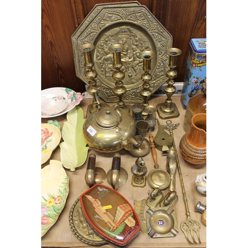 111 - Brassware to include two pairs of diamonds type candlesticks, an amber handled kettle, two curling s... 