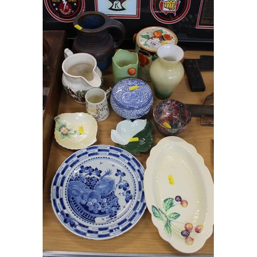 139 - Decorative ceramics to include a Bourne Denby blue pottery jug, an L & Sons Ltd biscuit barrel, ... 