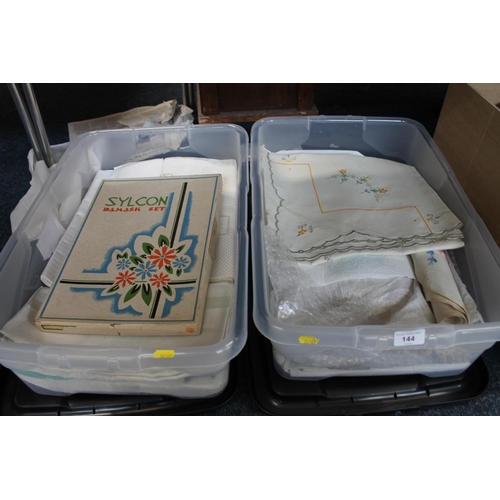 144 - Two boxes containing table linens to include damask sheets, embroidered tablecloths, etc.