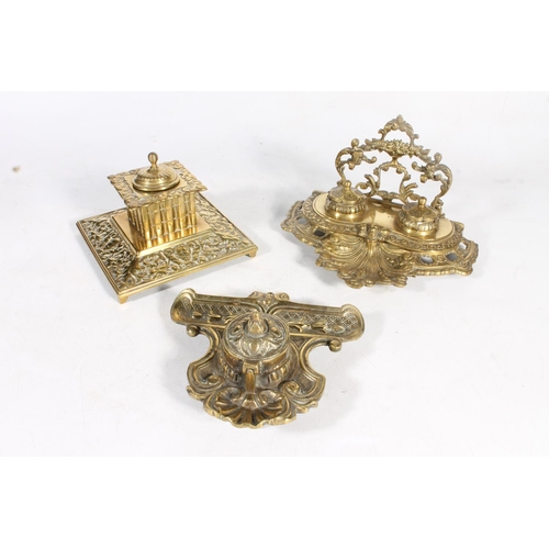 17 - Three ornate brass inkwells.