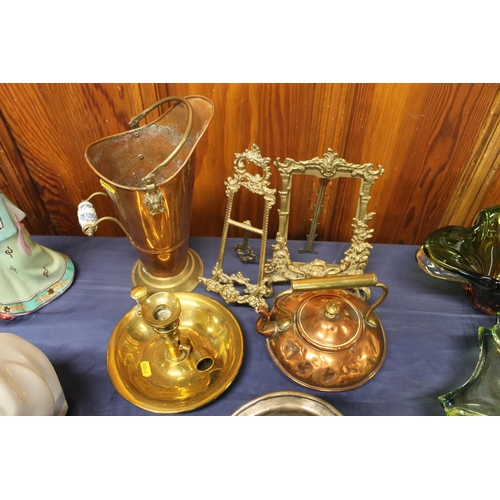 31 - Brass and copper ware to include easel backed photo frames, small kettle, etc.