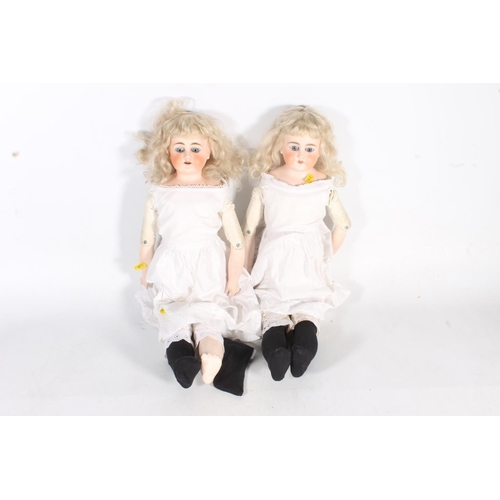 36 - Pair of early 20th century bisque headed dolls, 59cm high.