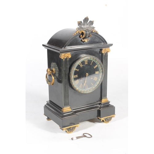 4 - Black slate and gilt painted mantel clock of classical design, 38cm high.