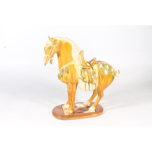 57 - Chinese Tang style sancai glazed pottery horse, 35cm high.