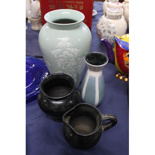 63 - Denby green and white glazed pottery vase, a Studio Pottery vase, and a black glazed jar and matchin... 