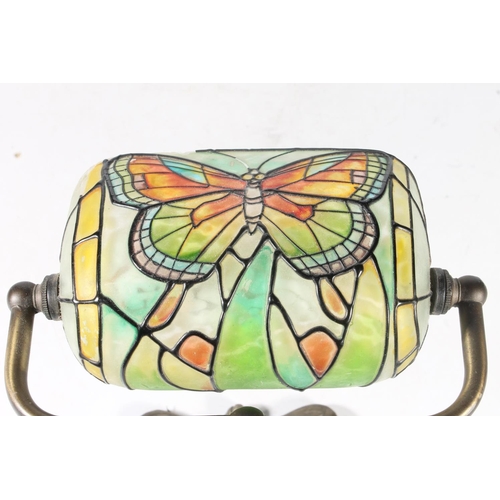 65 - Tiffany style reading lamp decorated with butterfly stained glass shade on butterfly shaped brass st... 