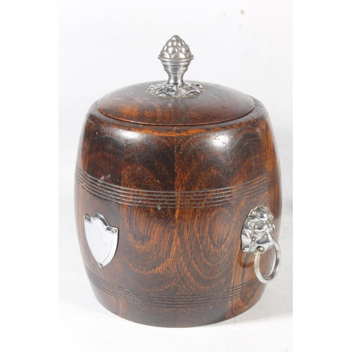 77 - Oak tobacco jar, and another treen tobacco jar.