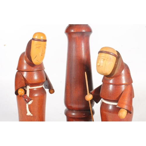 9 - Turned and carved wooden table lamp in the form of two monks.